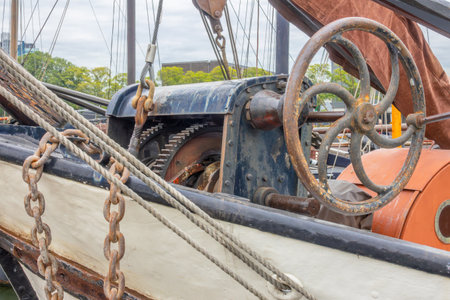 Netherlands. Vintage mechanical winch on a very old ship in Amsterdam