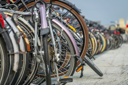 Netherlands. A lot of parked bicycles in an outdoor bicycle parking area near Amsterdam Central...