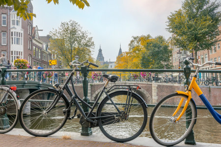 Netherlands. Autumn day on a canal in the center of Amsterdam. Lots of bicycles on the embankmentsの写真素材