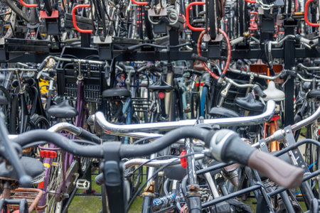Netherlands. Double-decker bike parking in Amsterdam. Lots of new and old bikes