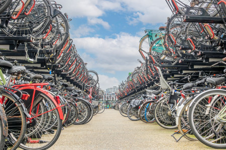 Netherlands. Two-level bicycle parking near Amsterdam Central Station. Lots of different bikesの写真素材