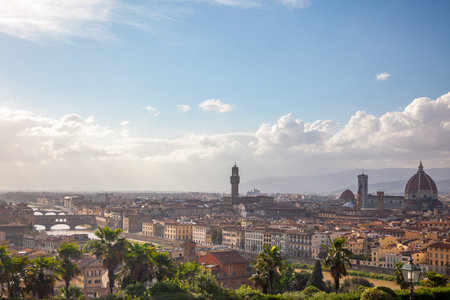 Italy. Sunny summer day in Florence. Roofs of the old city and the Arno river with bridgesの写真素材