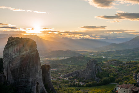 Mountains of Thessaly in Northern Greece. The last rays of sunset over the Meteora rocks and the...