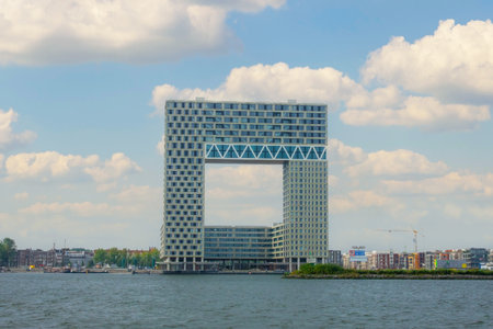 Netherlands. Summer day in Amsterdam. Modern office building on the shore of the Amstel riverの写真素材