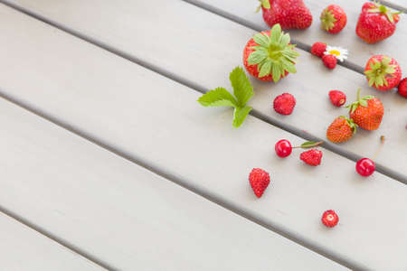Top view on fresh organic strawberries on the grey table background. Healthy food concept.の写真素材