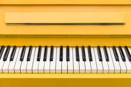 Top view on yellow piano. Closeup of piano keys. Music conceptの写真素材