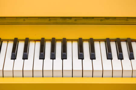 Top view on yellow piano. Closeup of piano keys. Music conceptの写真素材