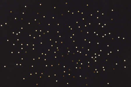 Golden stars on black backgroundの写真素材