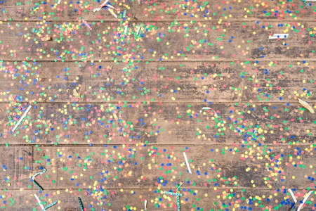 Wooden background with party confetti.の写真素材