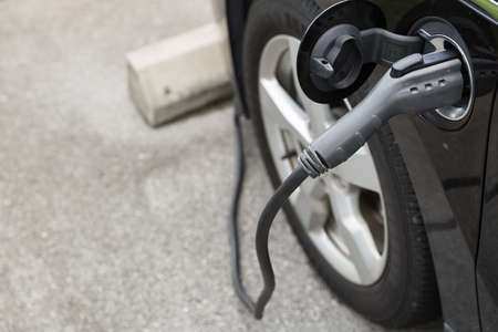 Electric car charging with station, Modern eco system, Save the earth conception.の写真素材