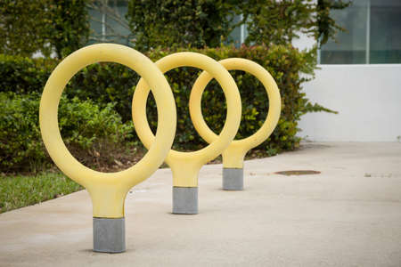 Urban modern landscape yellow rings low parking space for bicycles.の写真素材