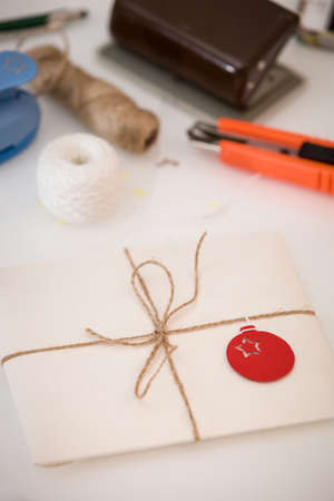 Preparation for Christmas and New Year. Envelopes, cards and handmade decor. Postcard in an envelope...