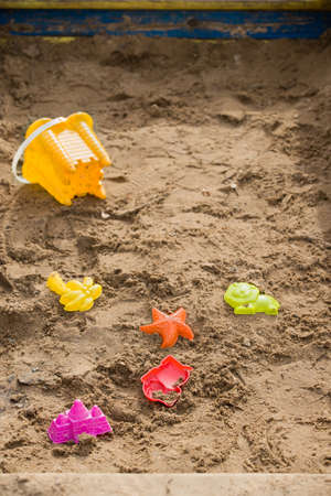 Colorful plastic toys in the sand on a playground.の写真素材