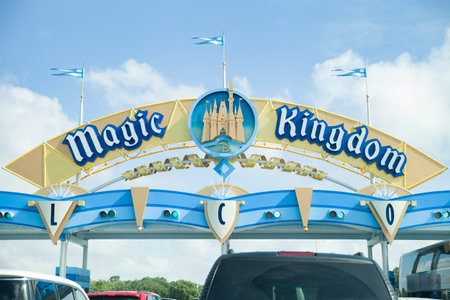 Florida, USA, May 23, 2013: Gates to the world of magic in Disney Park by Magic Kingdom. Many cars with parents and children waiting in line to get to Disney Park in Orlando.のeditorial素材