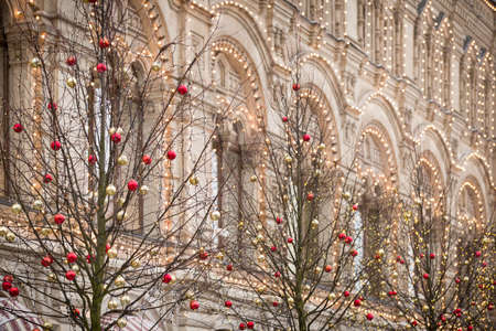Christmas holiday decorations in the center of Moscow. Christmas toys hang on the branches of...