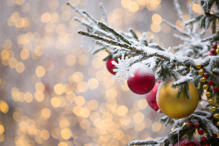 Christmas decorations on evergreen tree branches with shining garlands in the center of New Year's festive Moscow. Selective focusの写真素材