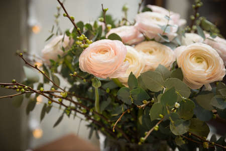 Closeup of beautiful pink roses in a transparent vase. Flowers for the holiday. A beautiful bouquet...