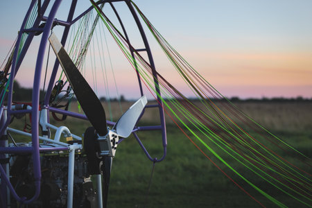 Closeup of a parajet cart with a no-spin engine and a propeller for two people on the take-off field. Extreme sports. Paragliding and small aircraft.の写真素材