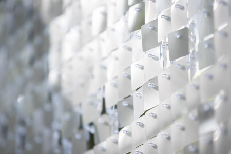Close-up abstract glitter background. Abstract structure texture. Silver sequin pattern. Sequin...