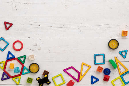 Close up of plastic multicolored constructor. Top view of children's educational toys, magnetic...