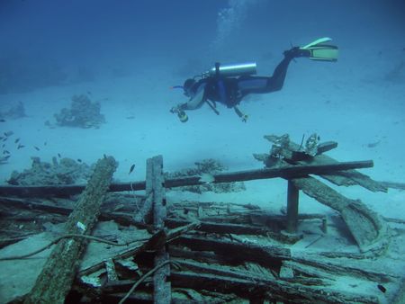 diver in deep and wreck of shipの写真素材