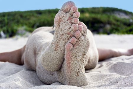 The man relaxing on the tropical beachの写真素材