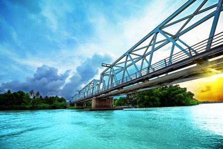 Railway bridge over the river at sunset time. Vietnam. Nha Trangの写真素材