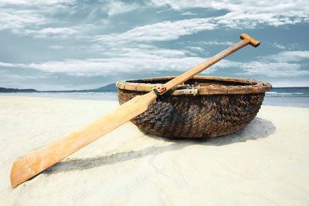Vietnamese boat like basket near the oceanの写真素材
