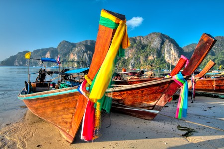 Traditional Thai longtail boats at Phi phi islandの写真素材