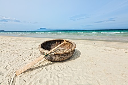 Vietnamese boat like basket near the oceanの写真素材