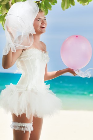 Beautiful young  bride on the tropical beachの写真素材