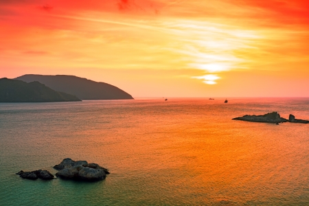 Sunrise over the sea. Stone on the foregroundの写真素材