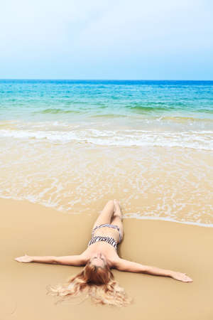 Beautiful woman in bikini on the beachの写真素材