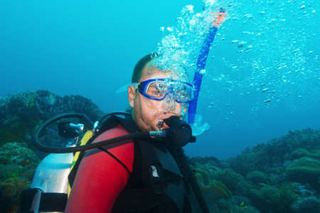 Scuba diver underwater making bubblesの写真素材