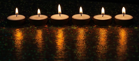 Burning candles on dark backgroundの写真素材