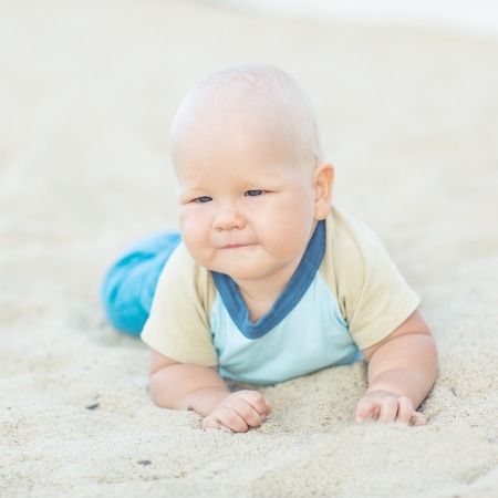 Cute baby on the tropical beachの写真素材