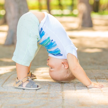 Baby doing yoga exercisesの写真素材