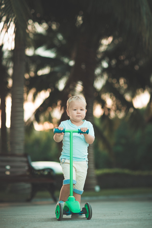 Boy with scooter outdoor. Leisure activityの写真素材