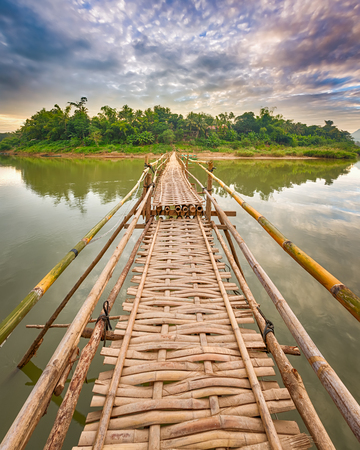 Beautiful view of a bamboo bridge. Luang Prabang. Laos landscape. の写真素材