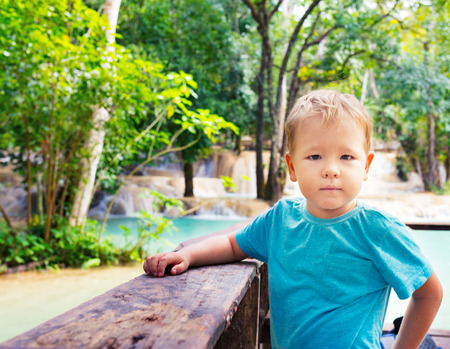 Child looking waterfall. Luang Prabang, Laosの写真素材