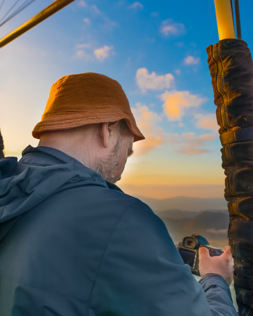 Photograther taking photo from air balloon during flight. Laos. Vang Vieng. Laos.の写真素材