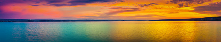 Sunset over the lake in Russia. Amazing landscape panorama