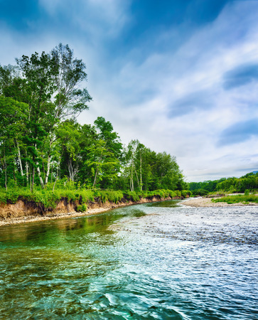 Beautiful russian landscape. Stream on the foreground. の写真素材
