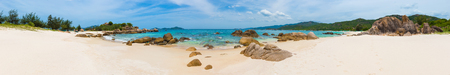 Beautiful white sand beach. Stones on a foreground. Landscape of Vietnam. Panorama