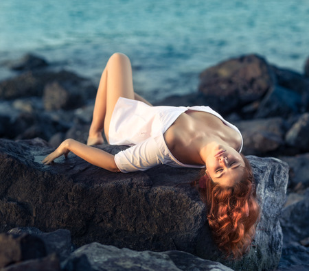 Portrait of a beautiful sexy woman outdoor. Model near the seaの写真素材