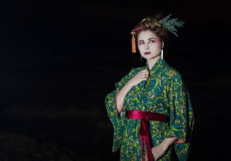 Fine art portrait of european woman in Japanese Geisha style wearing kimonoの写真素材