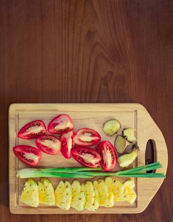 Ingredients set for sweet and sour sauce. Tomatoes, pineapple, lemongrass and gingerの写真素材
