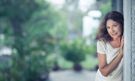 Outdoor portrait of a beautiful smiling senior womanの写真素材