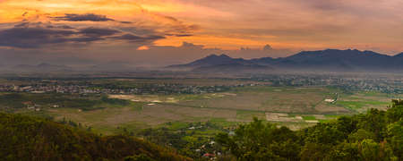 Beautiful landscape view of rice field and mountains at sunset. Panoramaの写真素材