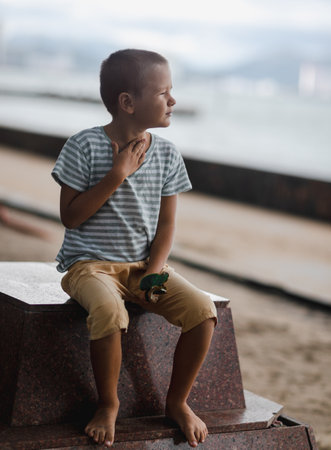 Outdoor portrait of a little cute boyの写真素材